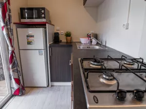 Cuisine suite parentale Cottage Duo Suite Premium jacuzzi 6 personnes dans les Landes au camping Le Vieux Port